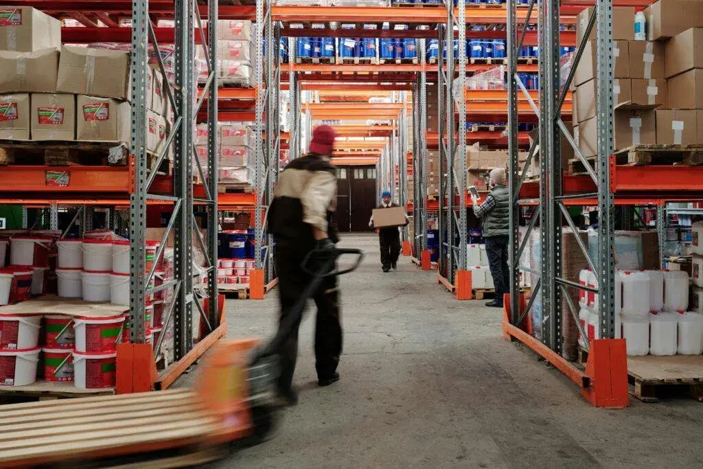 Workers moving goods in a warehouse