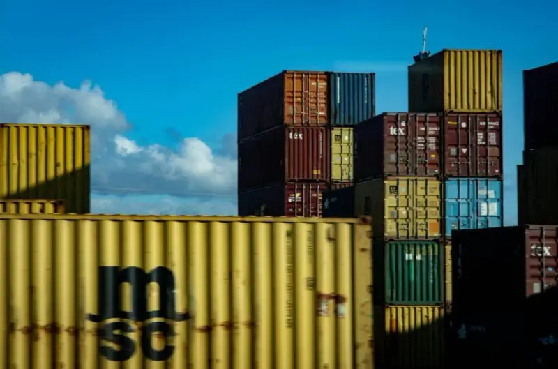 Shipping containers stacked at a port
