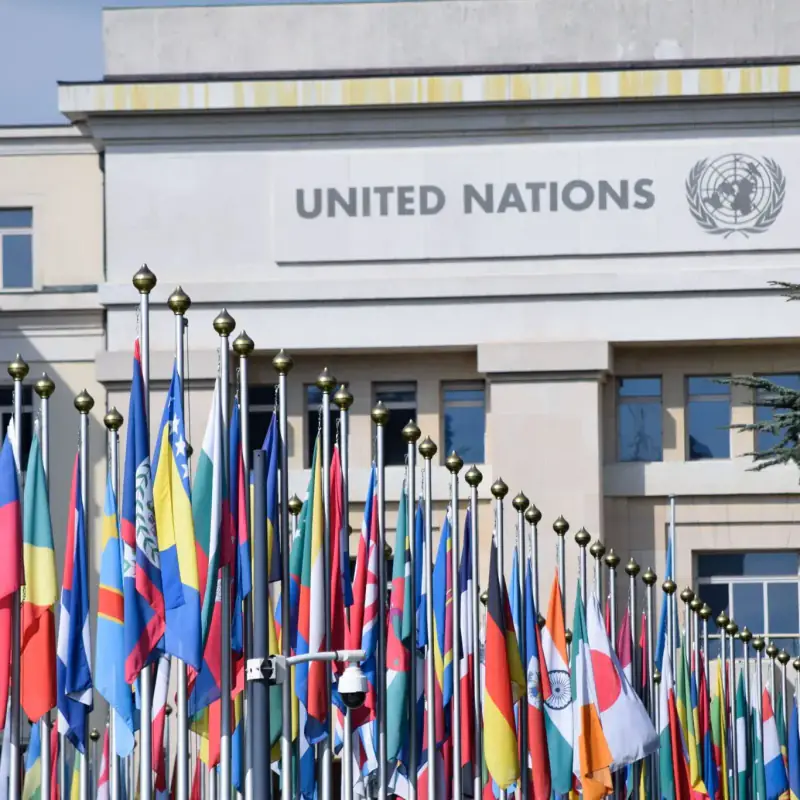 United Nations headquarters facade with national flags